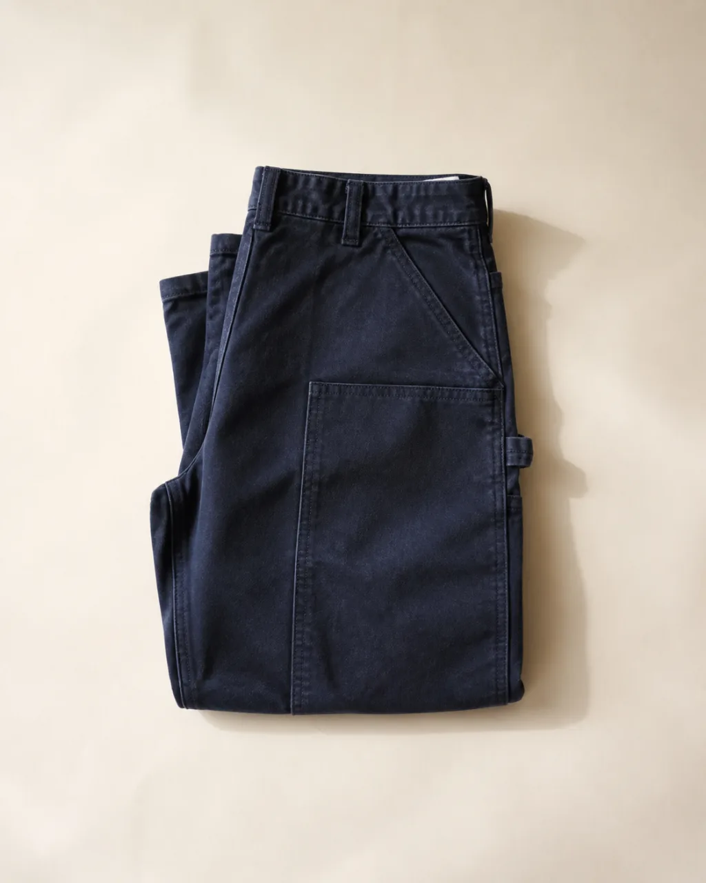 a folded, flat-laid pair of work pants